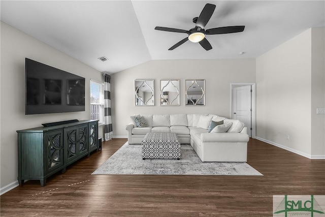 living area with dark wood-style floors, visible vents, baseboards, and vaulted ceiling