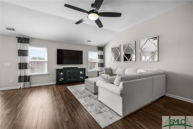 unfurnished living room featuring lofted ceiling, wood finished floors, and a healthy amount of sunlight