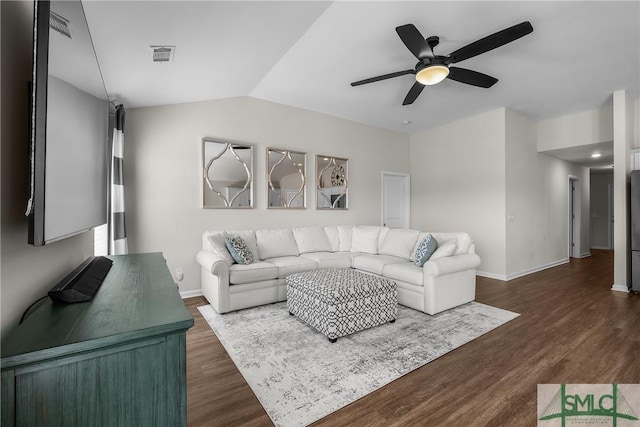 living area featuring visible vents, ceiling fan, baseboards, lofted ceiling, and dark wood-style flooring