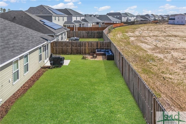 view of yard featuring a residential view and a fenced backyard