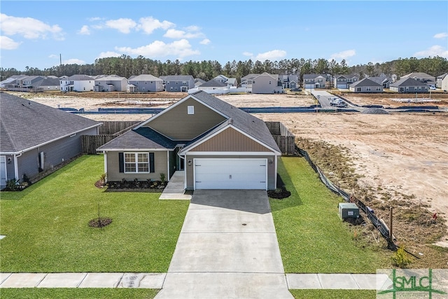 view of front of property with a front lawn, fence, a residential view, concrete driveway, and a garage