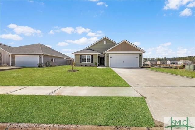 view of front of home with a front yard, a garage, and driveway