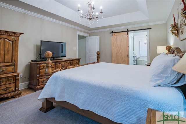 bedroom featuring crown molding, baseboards, a chandelier, a tray ceiling, and a barn door