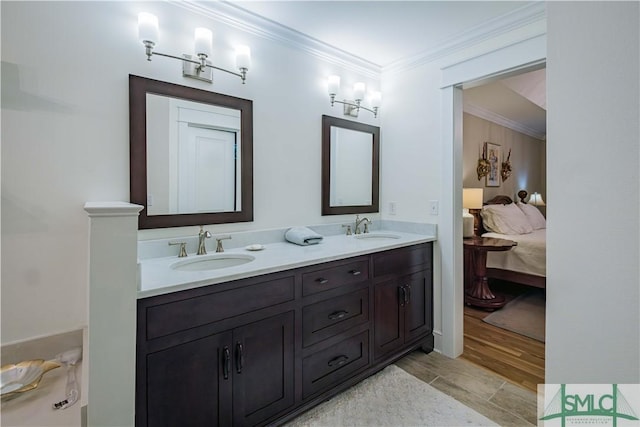 full bath featuring crown molding, double vanity, ensuite bathroom, and a sink