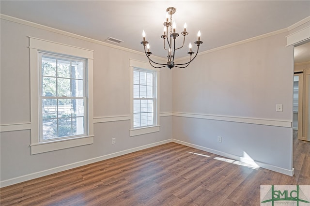 interior space with a healthy amount of sunlight, wood finished floors, and ornamental molding