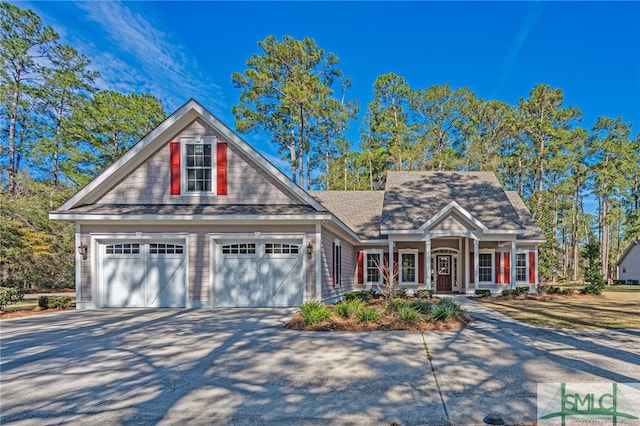 view of front of house with concrete driveway and a garage