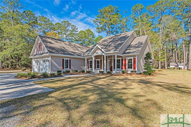 view of front of home with a front lawn and a garage