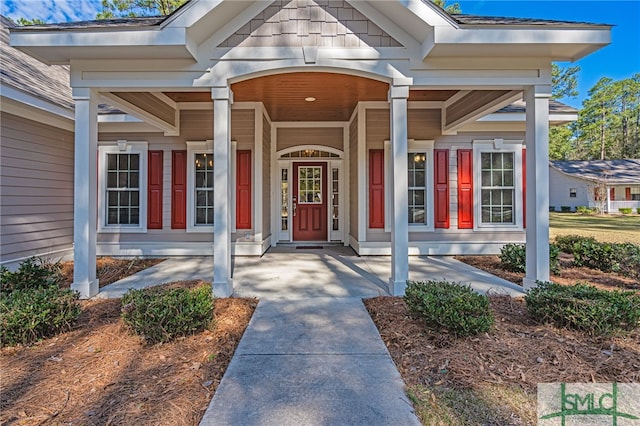 property entrance with a shingled roof