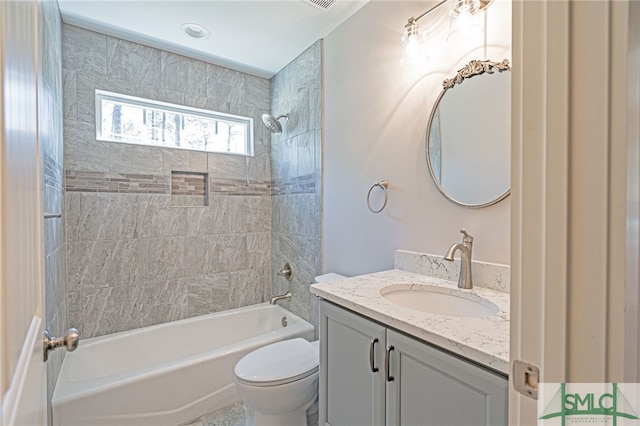 full bathroom with toilet, vanity, and shower / tub combination