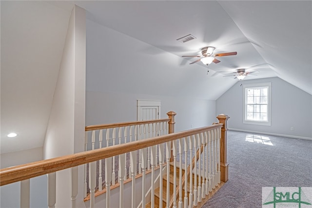 bonus room with visible vents, baseboards, lofted ceiling, and carpet floors