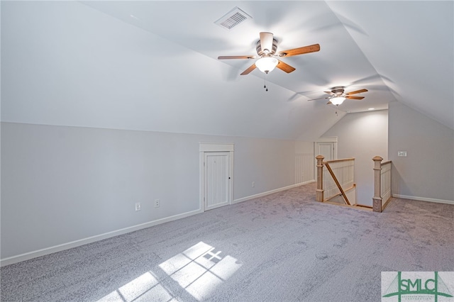 bonus room with visible vents, carpet, baseboards, and vaulted ceiling