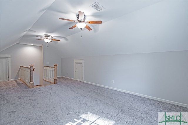 bonus room with visible vents, baseboards, ceiling fan, lofted ceiling, and carpet flooring