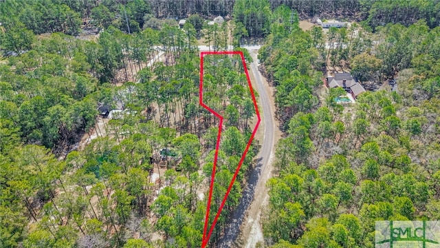 aerial view with a wooded view