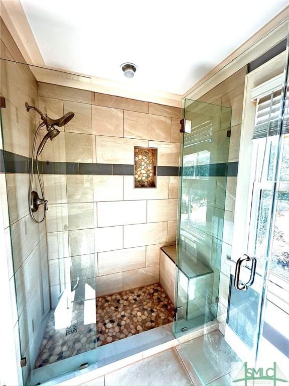 full bathroom featuring a shower stall