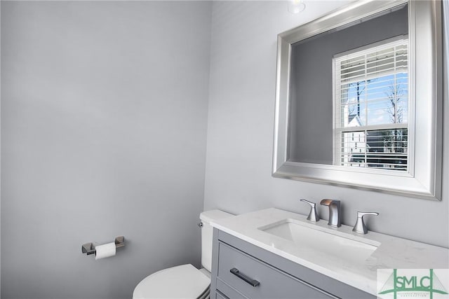 bathroom with vanity and toilet