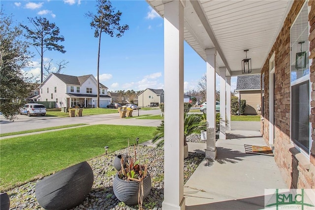 view of patio with a residential view and covered porch