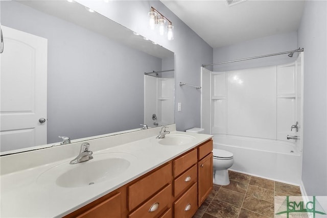 bathroom featuring double vanity, toilet, shower / tub combination, and a sink