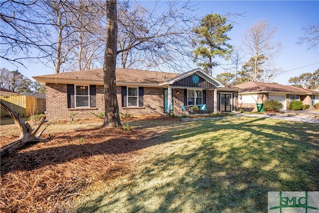 single story home featuring brick siding, a front yard, and fence