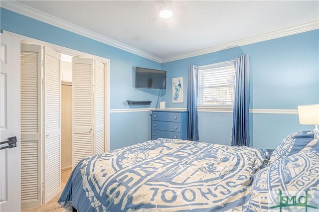 bedroom featuring carpet, a closet, and ornamental molding