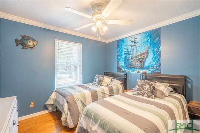 bedroom with baseboards, a textured ceiling, ornamental molding, and light wood finished floors