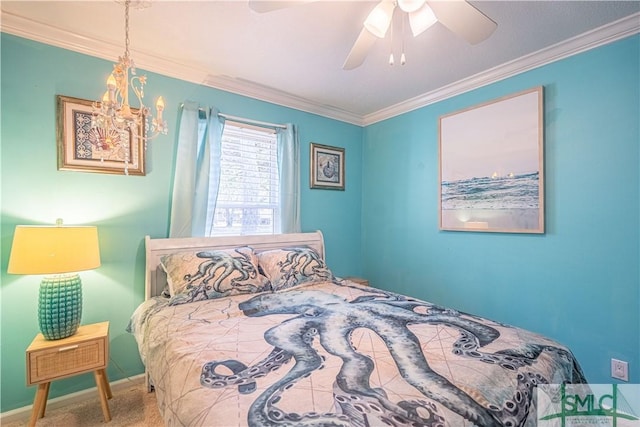 carpeted bedroom featuring crown molding, ceiling fan with notable chandelier, and baseboards