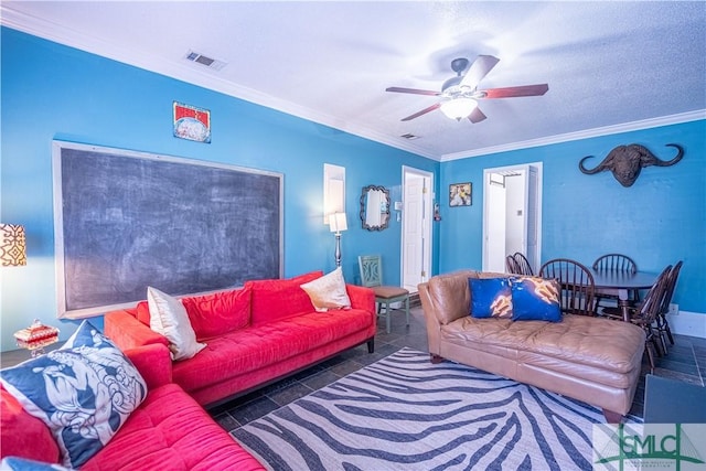 living area featuring visible vents, a ceiling fan, crown molding, and tile patterned flooring