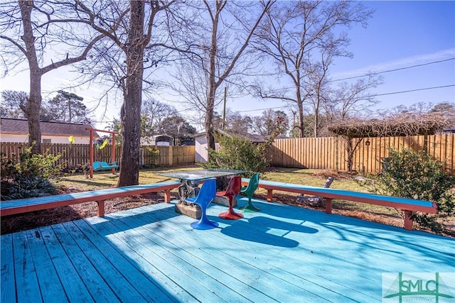 deck with a fenced backyard