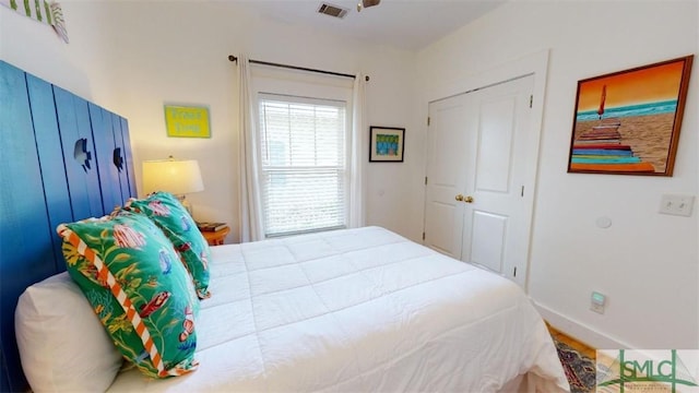 bedroom with visible vents and baseboards