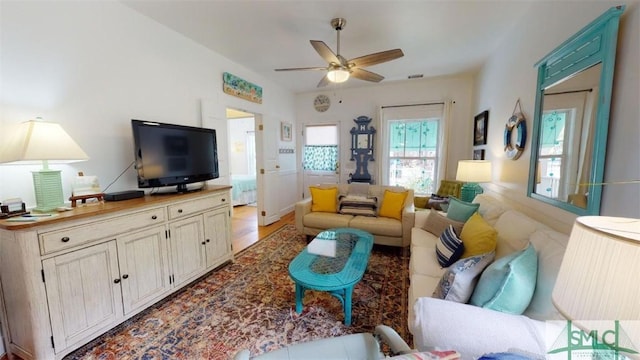 living area with a ceiling fan