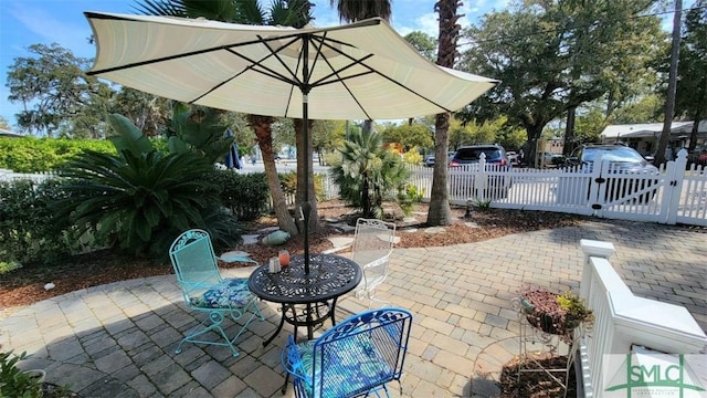 view of patio / terrace featuring fence