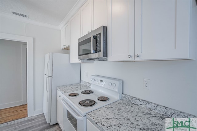 kitchen featuring stainless steel microwave, visible vents, crown molding, white range with electric cooktop, and white cabinets