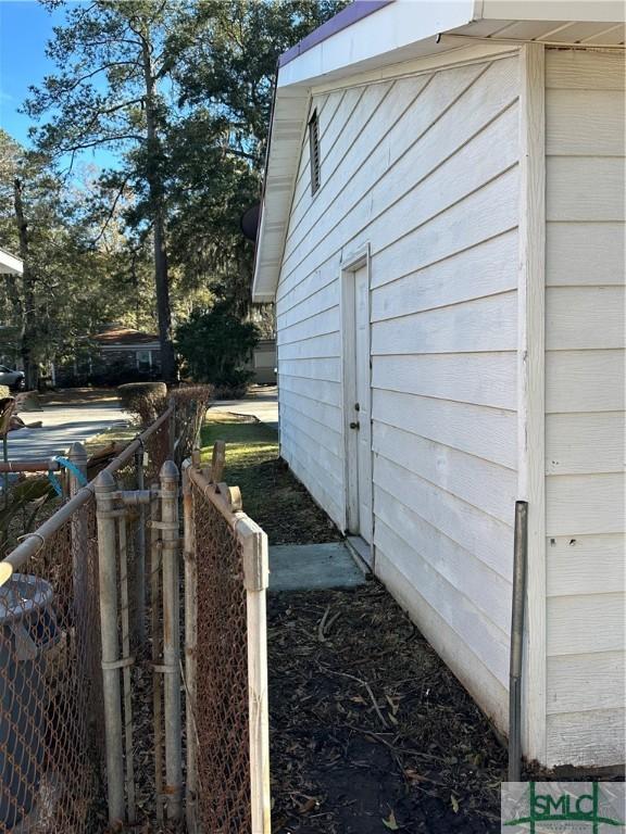 view of home's exterior featuring fence