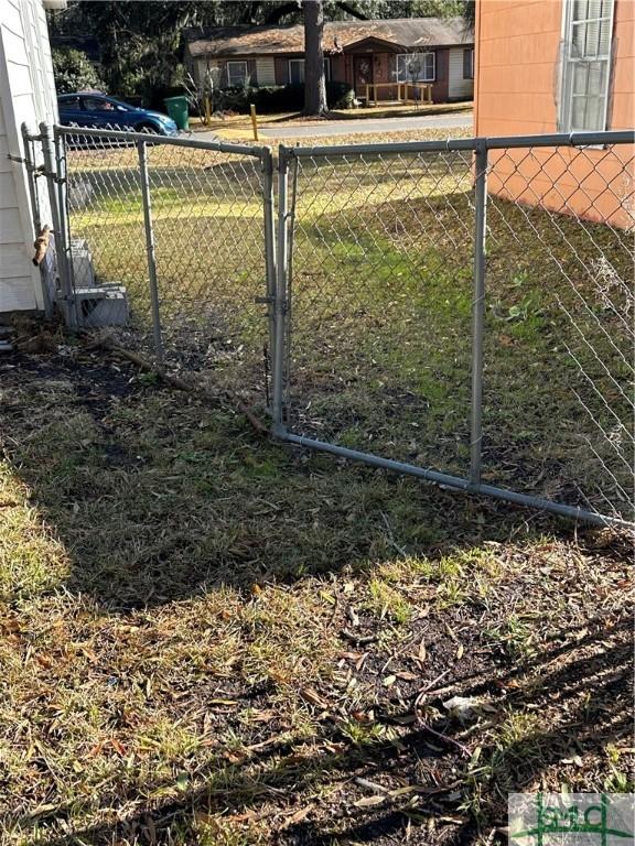 view of gate with fence