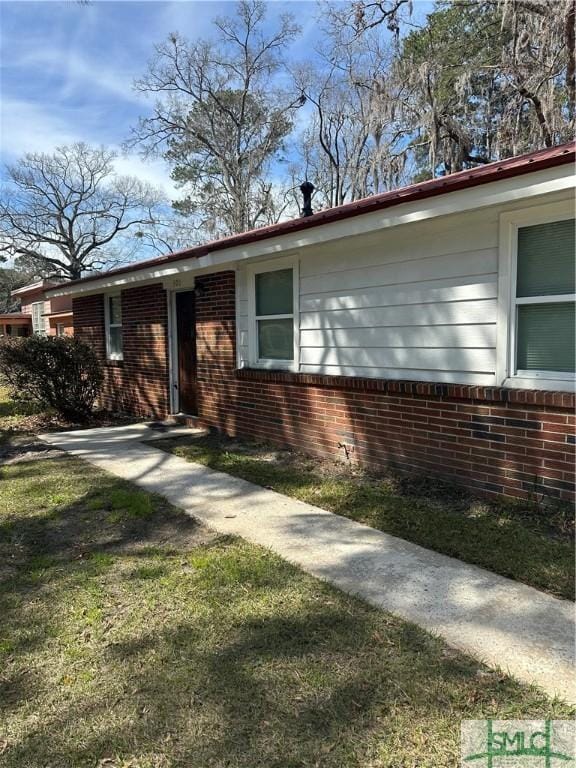 view of front of house featuring brick siding