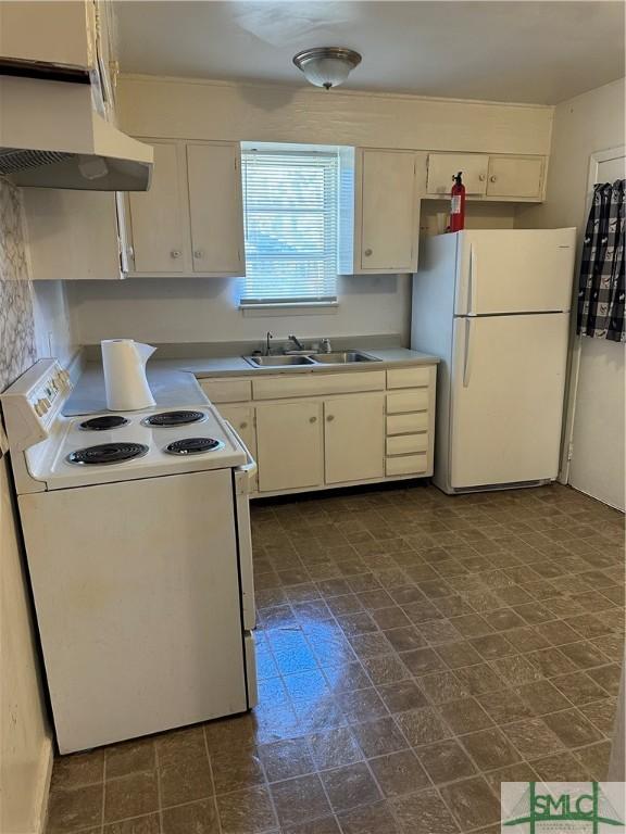 kitchen featuring white appliances, a sink, light countertops, white cabinets, and under cabinet range hood