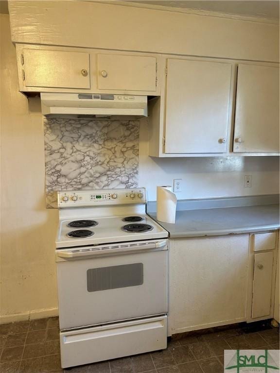 kitchen with backsplash, under cabinet range hood, light countertops, electric stove, and white cabinets