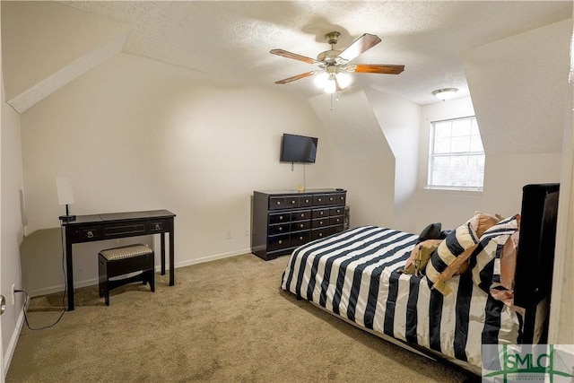 bedroom featuring lofted ceiling, a textured ceiling, carpet, baseboards, and ceiling fan