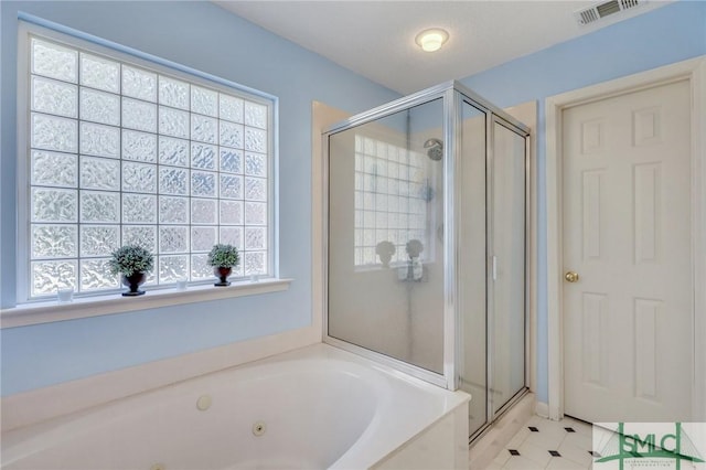 full bathroom featuring a jetted tub, visible vents, and a stall shower