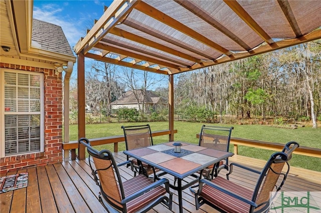 deck with a lawn, a pergola, and outdoor dining area