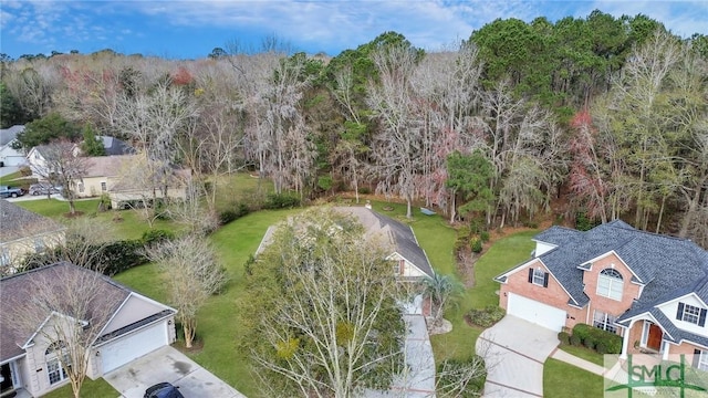 bird's eye view featuring a wooded view