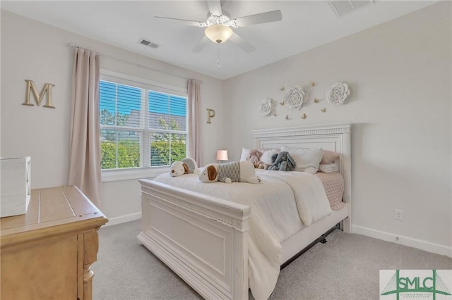 bedroom with light colored carpet, visible vents, and baseboards