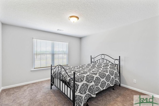 bedroom with visible vents, baseboards, and carpet floors