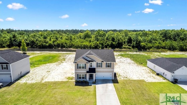 drone / aerial view featuring a view of trees