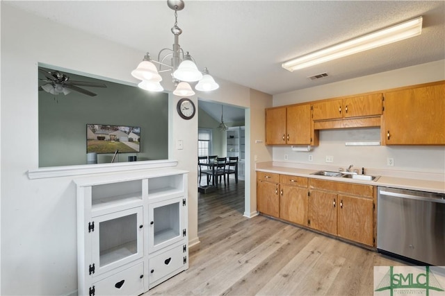 kitchen with visible vents, a sink, light wood-style floors, light countertops, and dishwasher