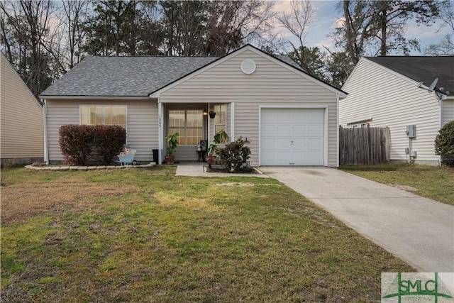 ranch-style home featuring a front lawn, fence, roof with shingles, driveway, and an attached garage