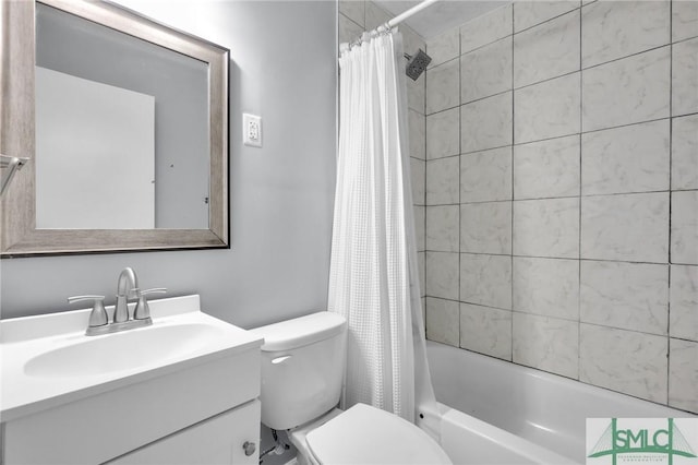 full bath with vanity, shower / tub combo, and toilet