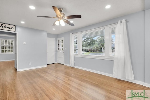 foyer with recessed lighting, light wood-style flooring, baseboards, and ceiling fan