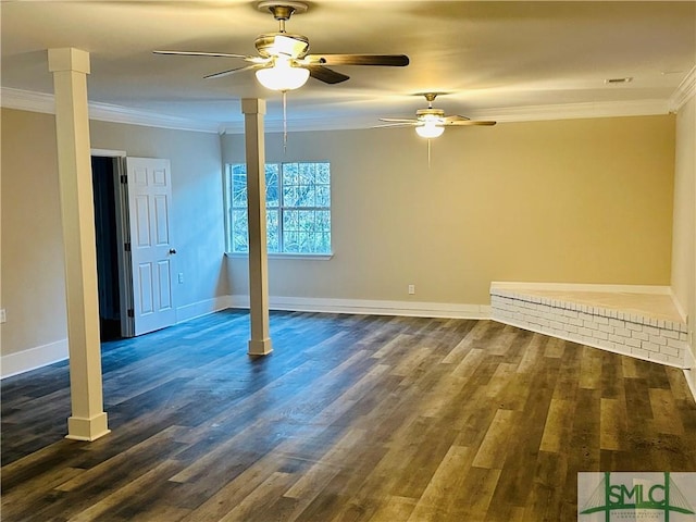 unfurnished room featuring baseboards, a ceiling fan, dark wood finished floors, and crown molding