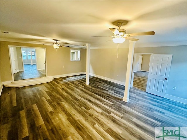 unfurnished living room with ceiling fan, baseboards, wood finished floors, and crown molding