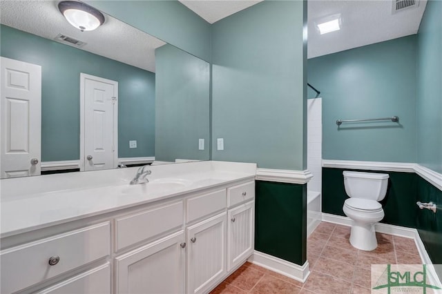 full bath with tile patterned floors, visible vents, toilet,  shower combination, and vanity